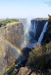 A rainbow completes the beauty of Victoria Falls even during low water.