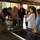Thiemo explaining to a school group how solar batteries work as part of the solar workshop theory